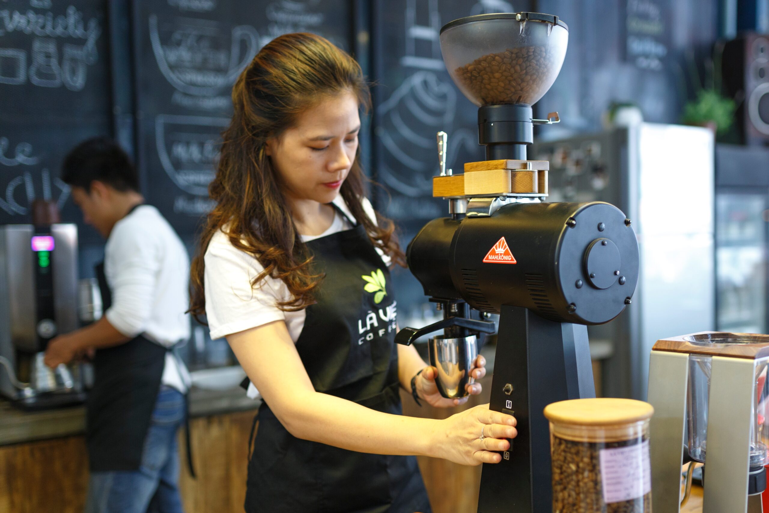 asian-woman-grinding-coffee-beans